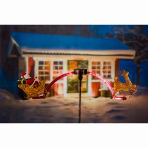 Santa and Reindeer Chasing White Light Solar Balancer Garden Stake